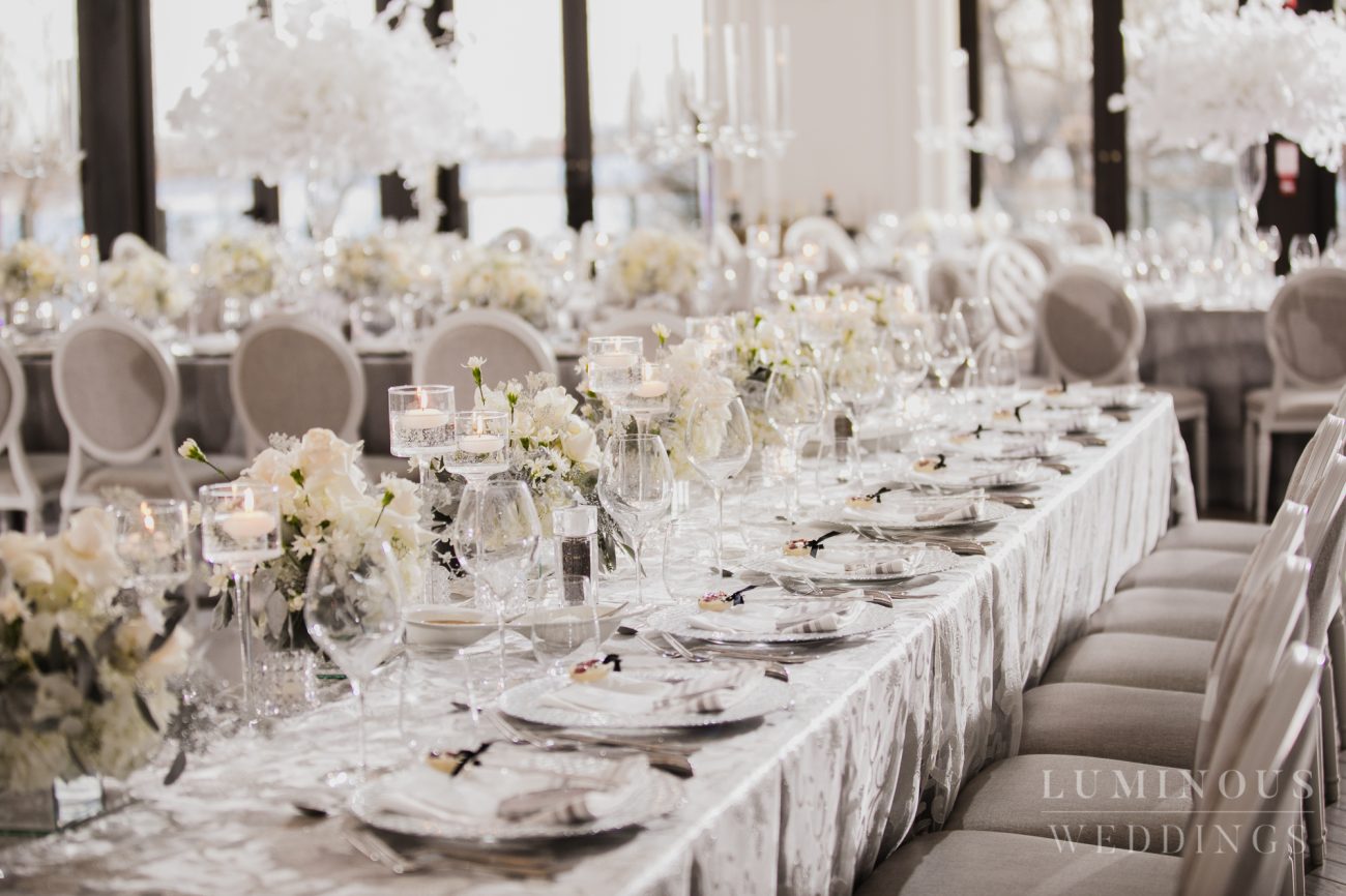 Elegant glass and white roses wedding decor