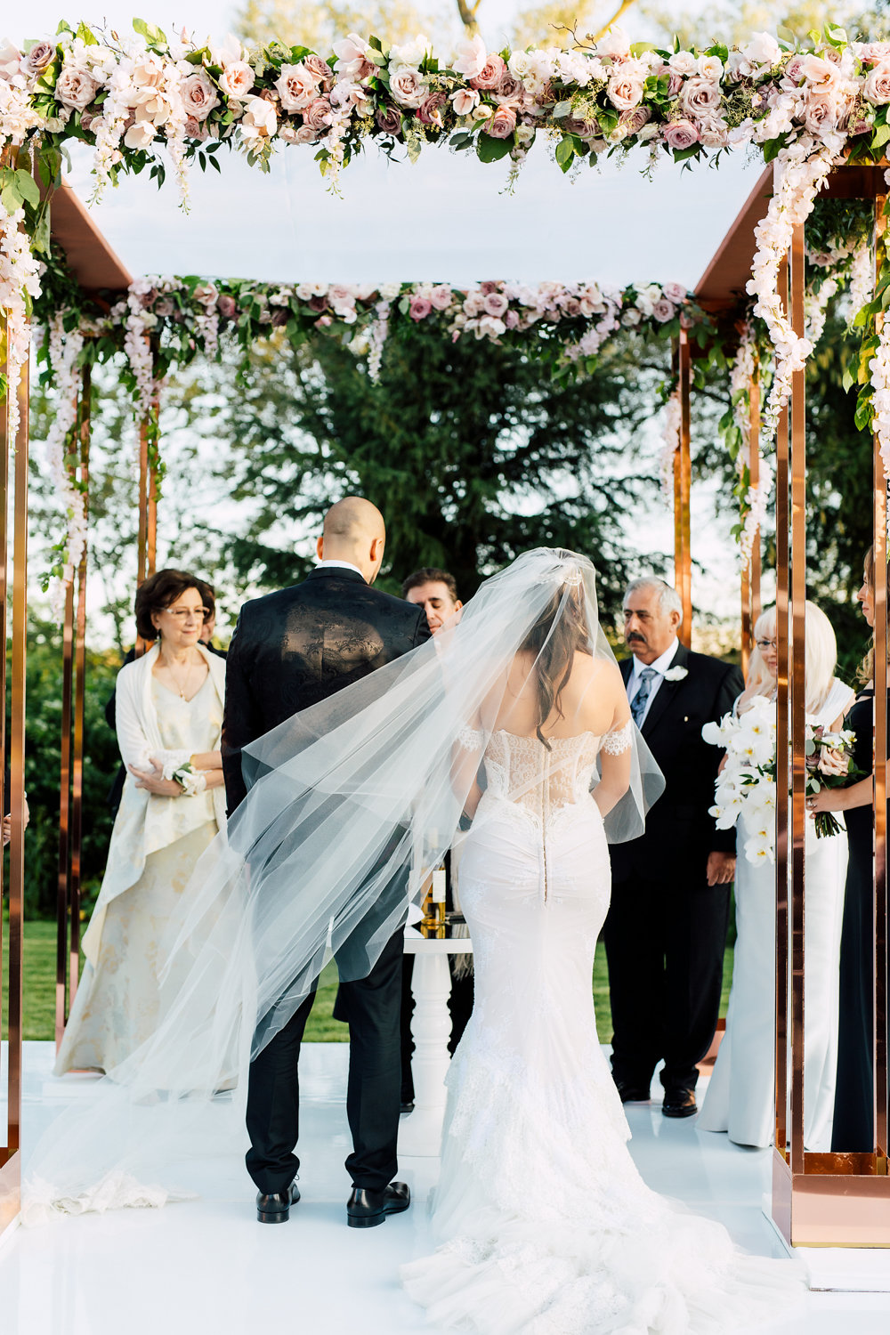 Outdoor wedding ceremony with pink roses