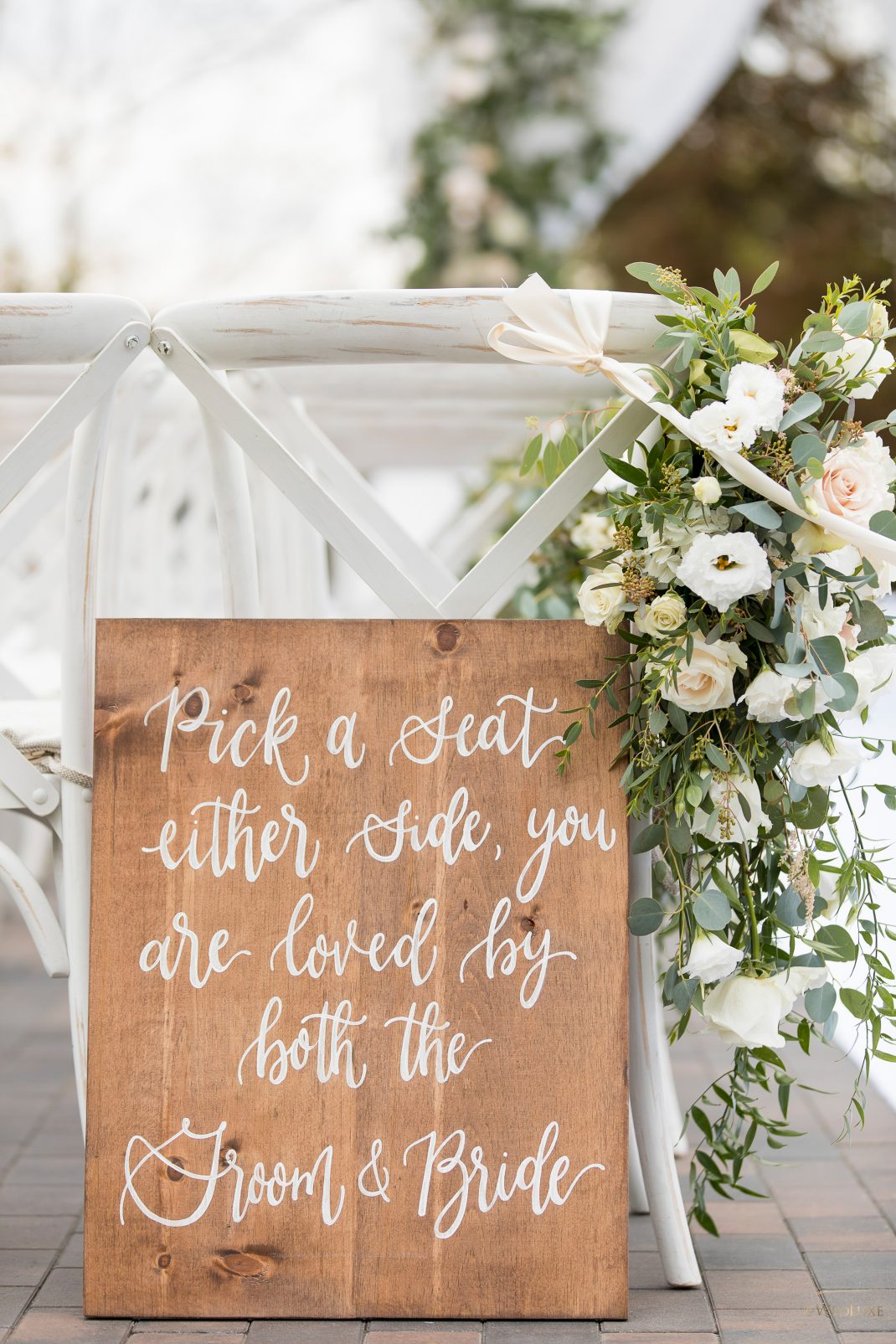 Rustic wood pick a seat sign for outdoor ceremony