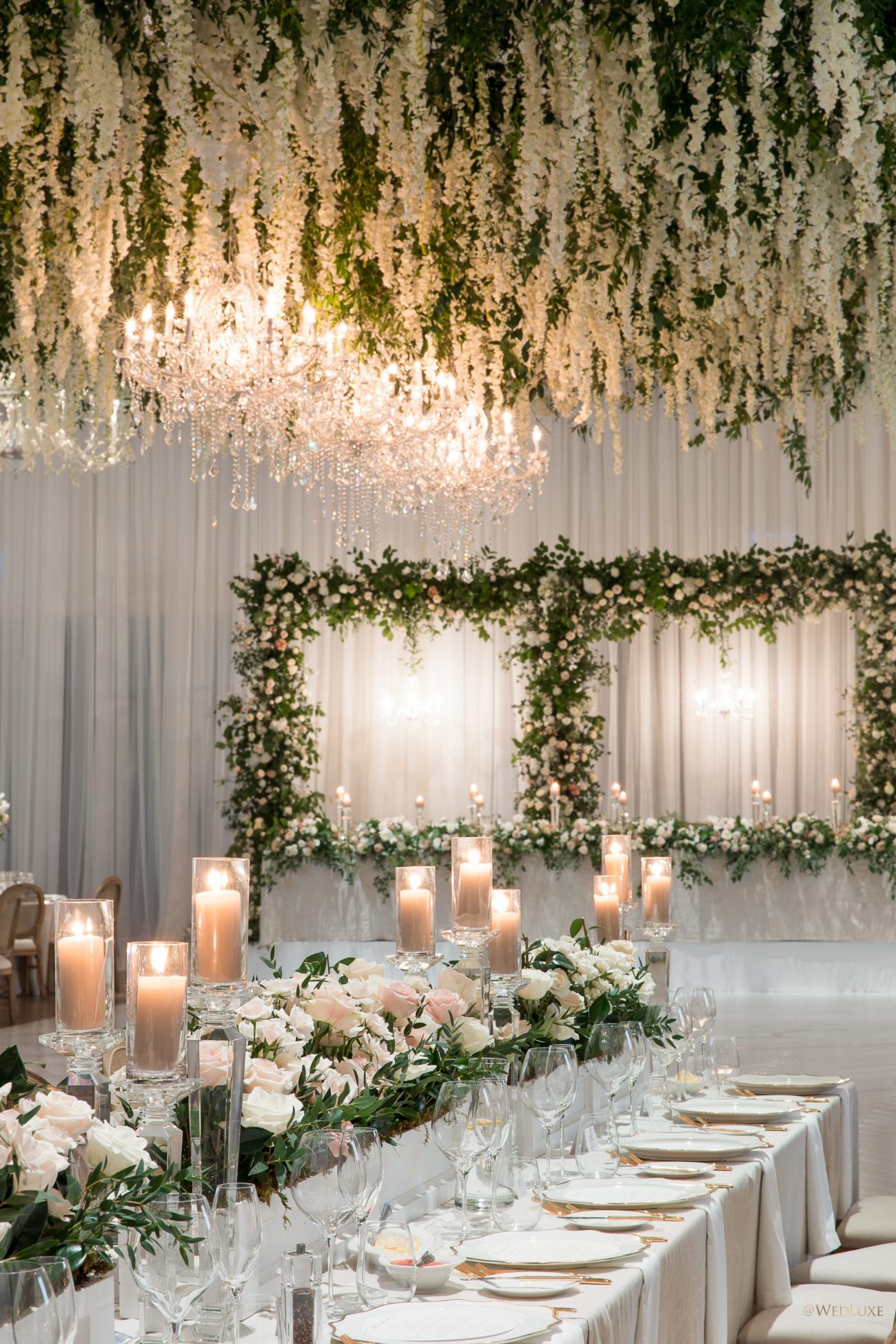 Stunning wedding decor with hanging wisteria blooms