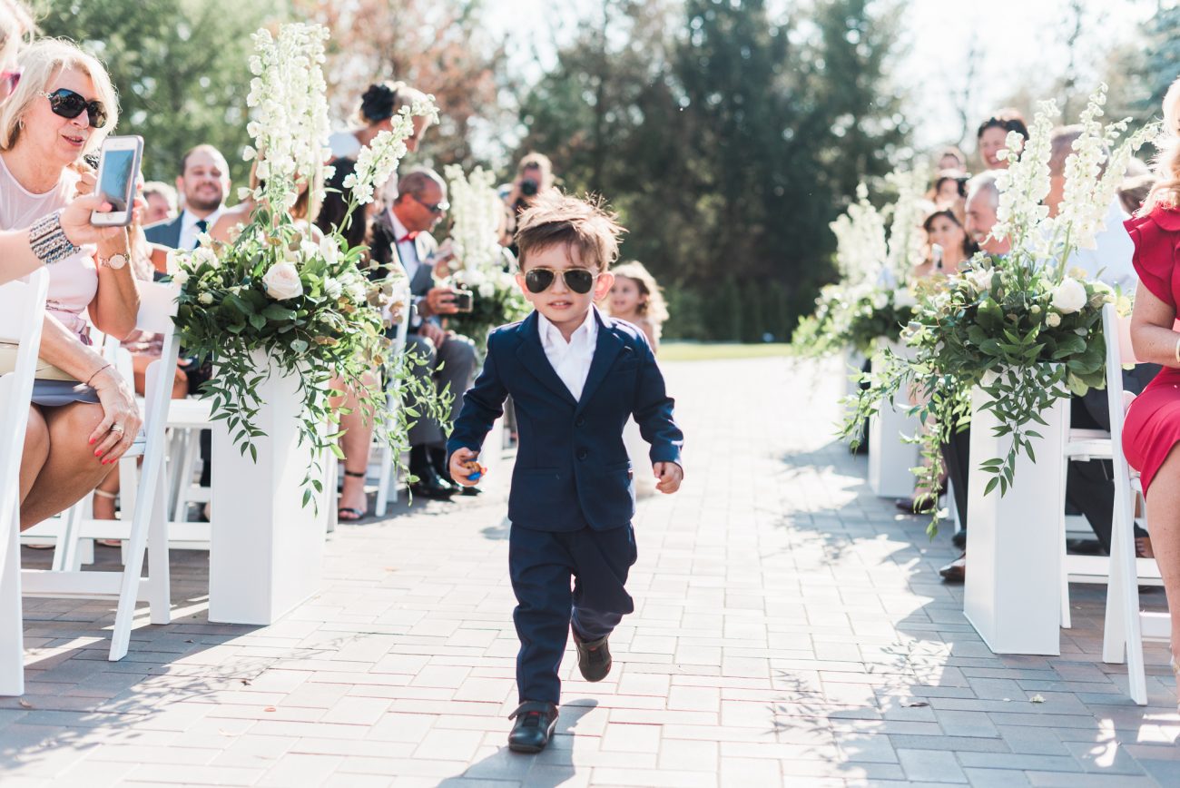 outdoor ceremony with ring bearer