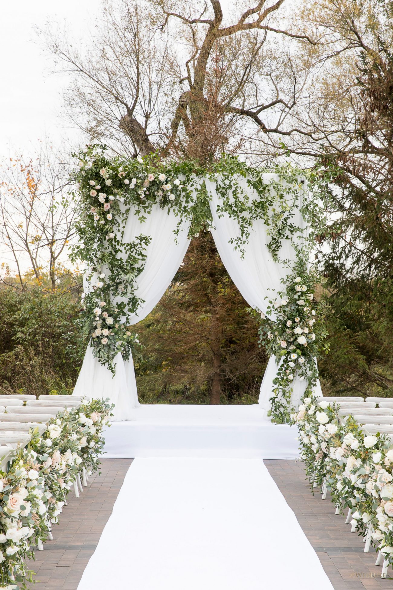 Outdoor ceremony blush and green wedding decor