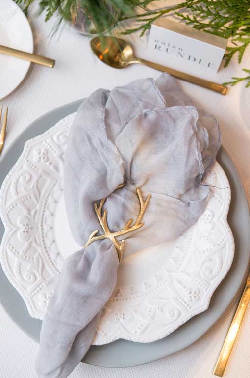 holiday table setting with antler napkin ring